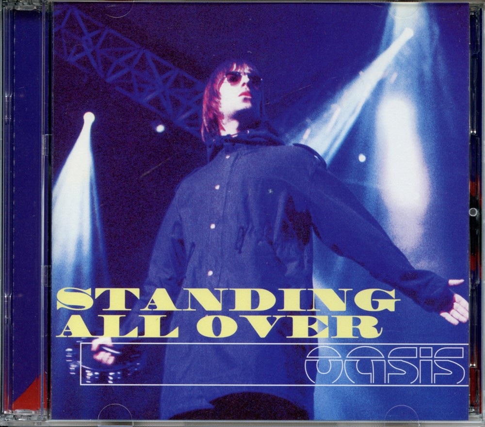 Oasis – Standing All Over ( 2 CD ) ( Flash Bulb ) (Live at Osaka Castle Hall, Osaka, Japan 03/05/2000 ) front cover Oasis - Standing All Over ( 2 CD ) ( Flash Bulb ) (Live at Osaka Castle Hall, Osaka, Japan 03/05/2000 ) front cover
